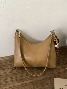 Chic camel faux leather crescent bucket bag with retro wooden bead charm for women