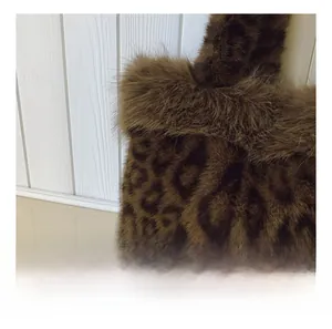 Macro shot of faux fur texture and leopard print pattern on a plush luxury tote bag