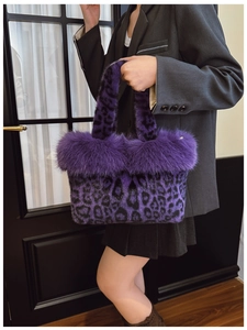 Detail of purple leopard print faux fur tote bag styled with a grey blazer outfit