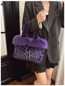 Detailed texture of purple leopard print faux fur handbag with stylish long plush fibers