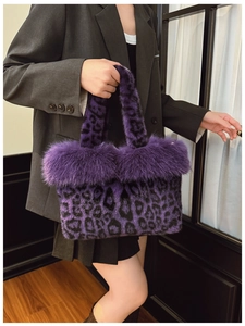 Close-up of luxury purple leopard print faux fur tote bag with plush textured handle
