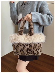 Detail of plush leopard print tote bag with soft faux fur trim and cozy autumn style