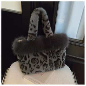 Detailed view of winter plush tote bag featuring leopard print and faux fur trim