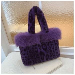Detail shot of the plush purple leopard print handbag with soft faux fur texture