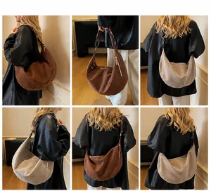 Dettagli borsa hobo in pelle scamosciata marrone e bianco crema su modelli per uso quotidiano