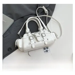 Mini white leather handbag with silver buckles and phone for size reference