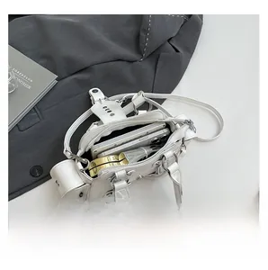 Interior view of a white leather bag showing storage for phone, perfume and makeup