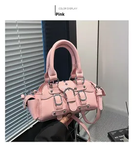 Detailed close-up of pink PU leather handbag with rivet studs and biker style hardware