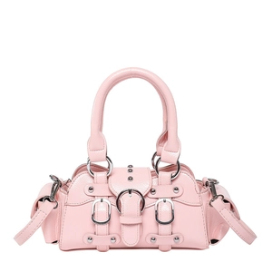 Detail of pink glossy faux leather handbag with silver metallic studs and buckles