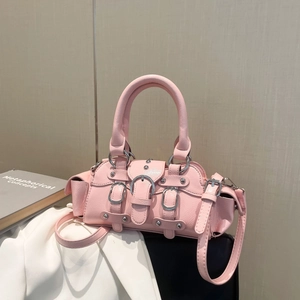 Pink moto-style handbag in glossy leather with silver buckles and a long shoulder strap
