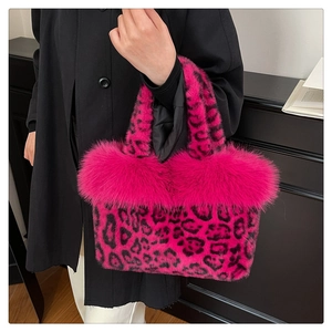 Detail of soft pink leopard print faux fur tote bag with plush textured handle