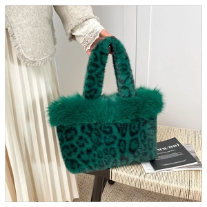 Detail of green faux fur leopard print handbag with plush texture and handle design