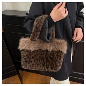 Detail showing plush leopard print handbag with fluffy faux fur texture and trim