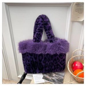 Detail of purple leopard faux fur handbag with fluffy plush trim and soft texture