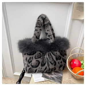 Detailed view of grey leopard print faux fur tote bag with thick plush trim and wide straps