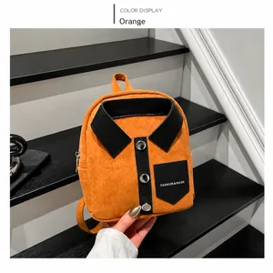 Detail view of orange shirt-style mini backpack with collar, buttons and fashion pocket