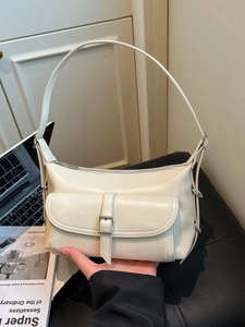 Cream vintage pillow shoulder bag with metal buckle and smooth leather finish