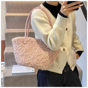 Pink plush tote bag detail with soft faux fur texture and PU leather straps