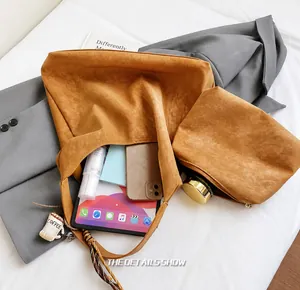 Brown suede tote bag interior showing large capacity for tablet, phone and makeup