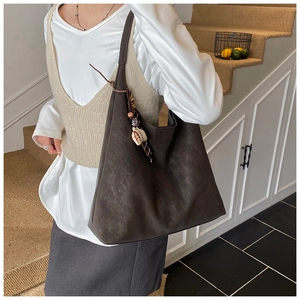 Large dark brown vintage tote bag with retro matte texture and ethnic beaded charm
