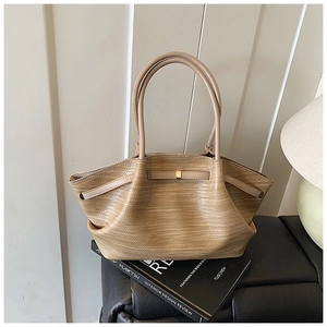 Detail of khaki woven texture tote bag featuring golden metal buckle and large capacity