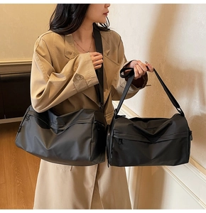 Comparison of two black nylon shoulder bags in large and small sizes for versatile daily use