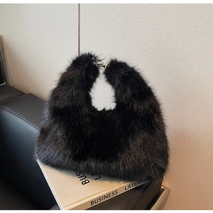 Detail of black faux fur tote bag showing plush texture and metal clasp closure