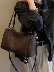 Retro dark brown leather Boston tote bag with gold lettering and metal lock accessory