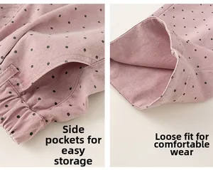 Detail of pink polka dot pants showing elastic waist with side pockets and loose leg hem