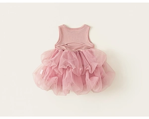Detail of baby girl's dusty pink tulle dress featuring back hollow-out design and soft mesh