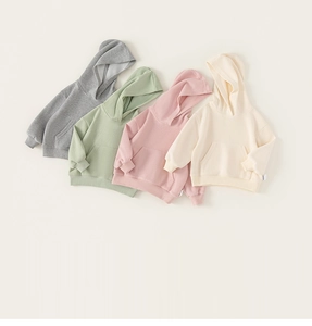 Flat lay of soft cotton hooded sweatshirts in four neutral Morandi colors with kangaroo pockets