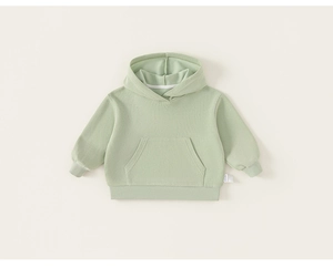 Detail view of light green toddler hoodie showing soft knit fabric and kangaroo pocket