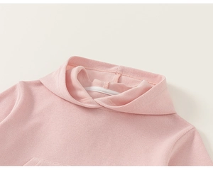 Close-up of pink hooded sweatshirt neckline featuring vertical rib-knit texture and stitching