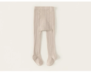 Close-up of oatmeal ribbed knit texture on high-elastic cotton baby tights for autumn