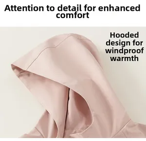 Detail view of pink girls hooded jacket with windproof fabric and hood structure