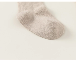 Close-up of baby ribbed cotton socks showing seamless toe detail and knit texture