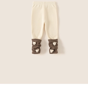 Detail of baby leggings with soft fleece lining and 3D plush bear charms on striped leg warmers