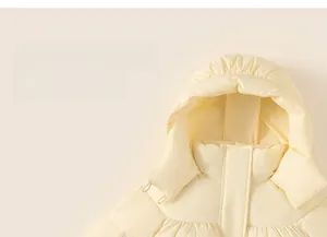 Detail of soft cream-yellow hooded puffer jacket with high-quality matte finish