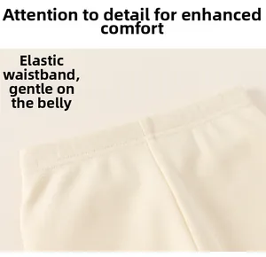 Detailed macro view of high-elasticity ribbed knit waistband on cream baby leggings