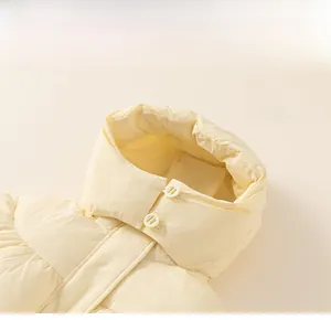 Detail of child's winter coat featuring a 3D windproof hood and warm double button closure