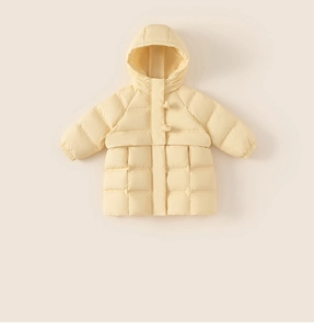 Close-up of cream yellow children hooded puffer coat with square quilting and warm cuffs