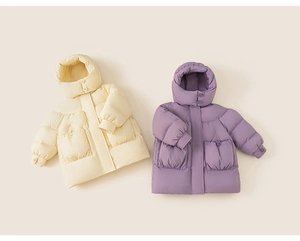 Close-up of windproof hood and large pockets on kids quilted down jacket in cream and purple