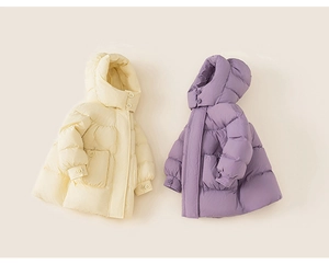 Detailed view of quilted hooded down coats for kids featuring large pockets and button cuffs