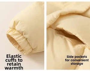 Detail of windproof elastic cuffs and side pockets on a warm yellow winter down jacket
