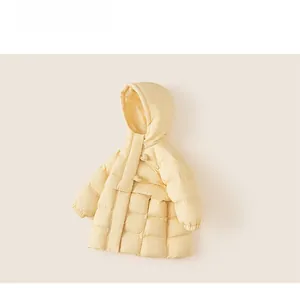 Close-up of cream hooded down coat with horizontal quilting and toggle closure for kids