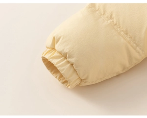Detail of windproof elastic cuffs on kid's winter down jacket with premium stitching