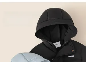 Close-up of hood detail on children's down jacket with zipper and metal buttons