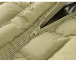 Macro detail of high-quality zipper and metal snap button on kid's long down coat