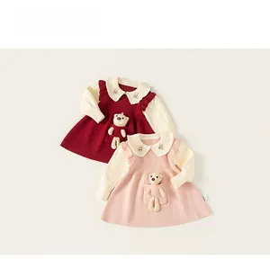 Detail of Peter Pan collar with bear embroidery and 3D plush doll on knitted dress