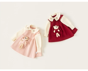 Detailed view of knitted dress with cute teddy bear pocket and rabbit collar embroidery